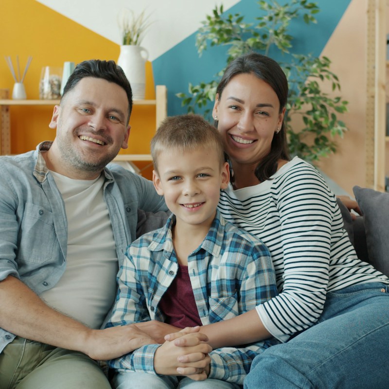 Family relaxing together in a clean living room